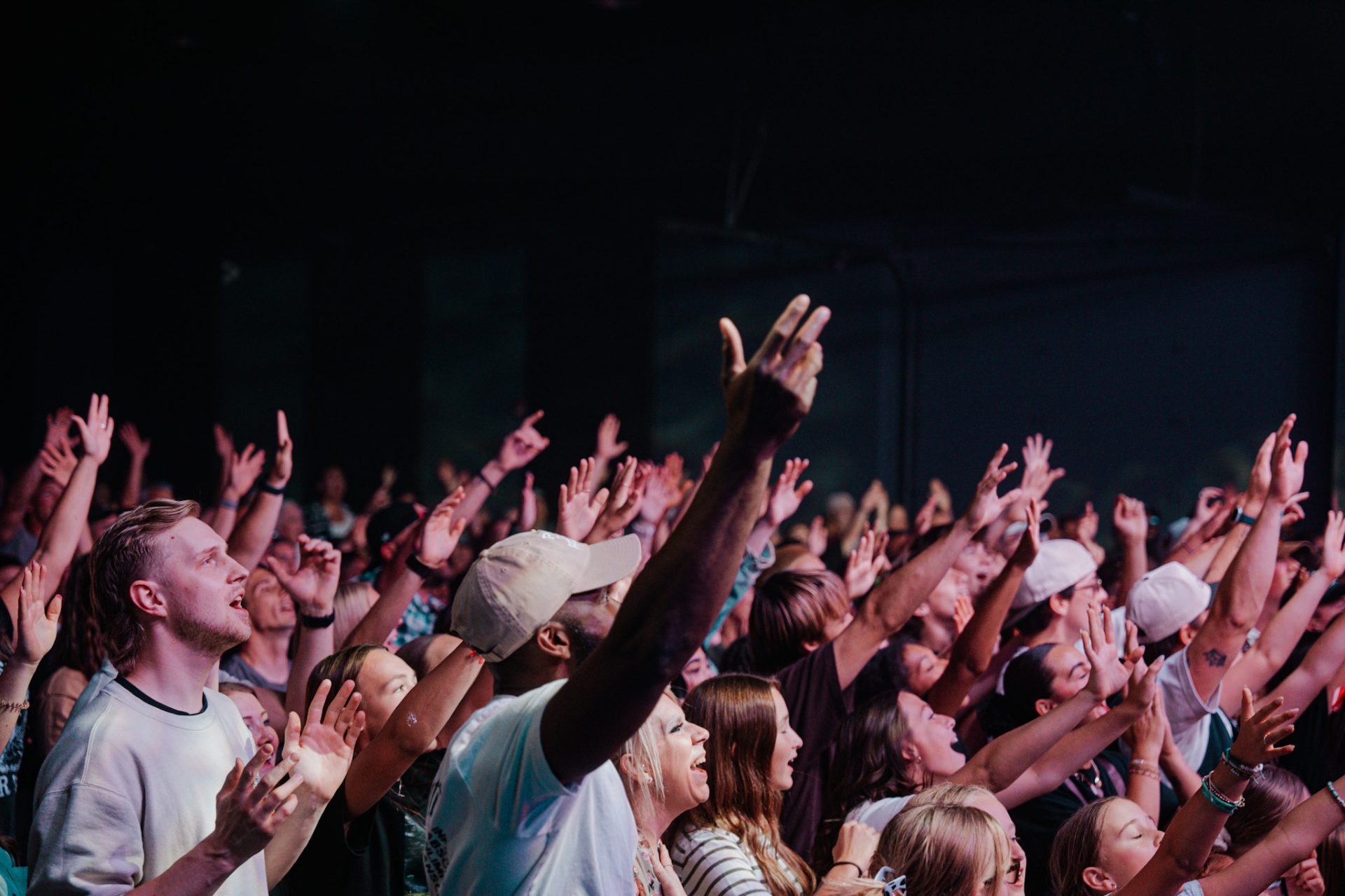 Hands raised in worship at Experience Church